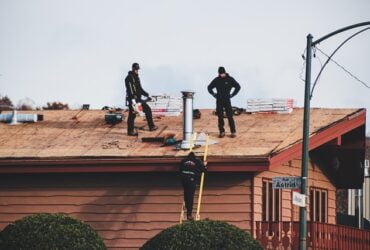 Roofers in the midst of a roof repair process.