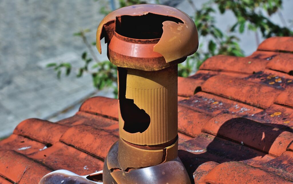 Hail Damage Roof Inspection - A Roof and Vents Damaged by Hail