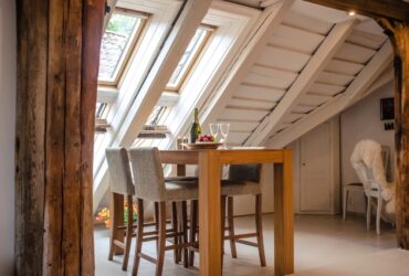 Skylights on the roof of a home from the inside in a utilized attic