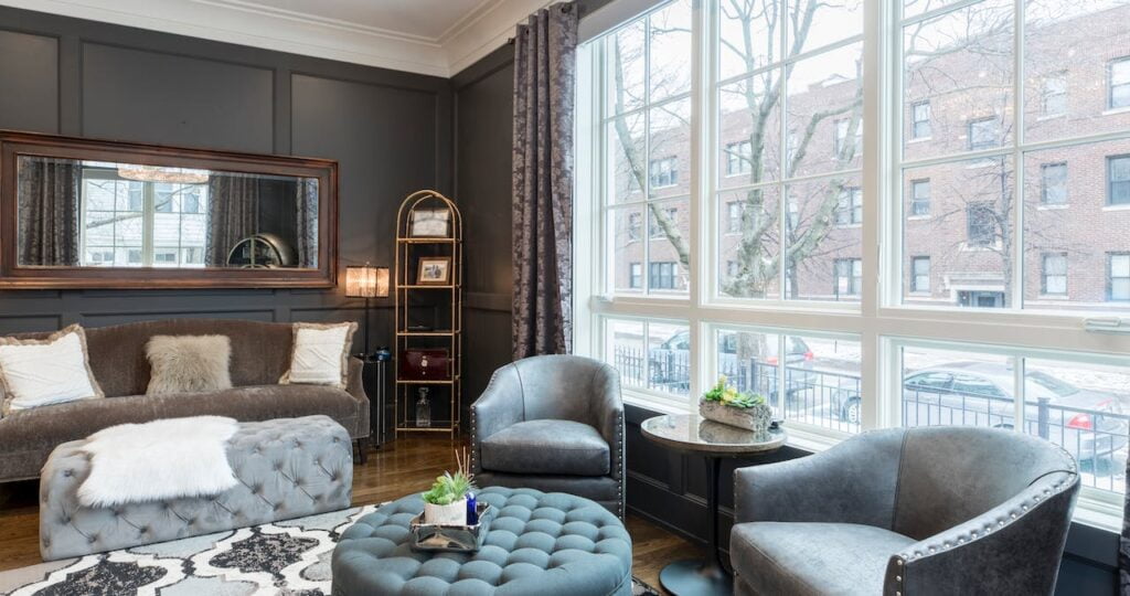 A living room with large windows.