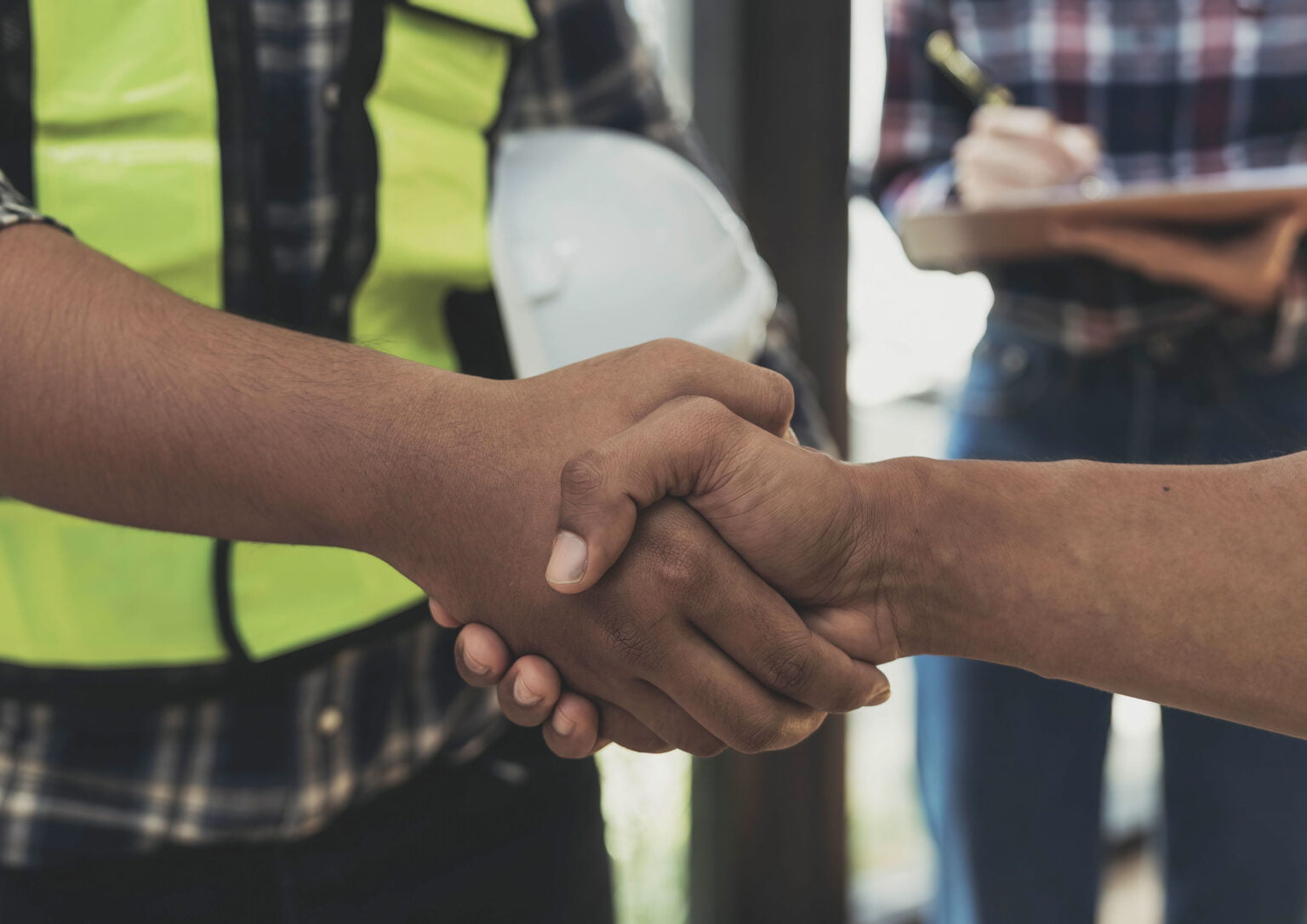 Commercial Roof Maintenance - A Contractor and a Business Owner Shaking Hands